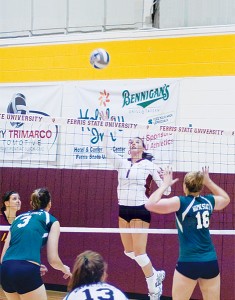 Senior Katie Edwards <span class='credit'>Photo By: Kristyn Sonnenberg | Photo Editor</span><span class='description'>Senior Katie Edwards jumps up for the spike at the game against Wayne State last Friday, Sept 11. Ferris beat Wayne State 3 to 2. </span>