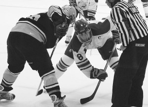 Face-off <span class='credit'>Photo By: Kristyn Sonnenberg | Photo Editor</span><span class='description'>Face-off: Senior Cody Chupp (#8) puts his best foot forward in a face-off against a Wilfred Laurier opponent. The team is going into their third official game this Friday against Connecticut.</span>