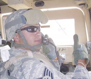 Securing the Premises: Steven Neshkoff checks the roads for IEDs (Improvised Explosive Devices) on the roadside while on duty in Iraq. Photo Courtesy of Steven Neshkoff