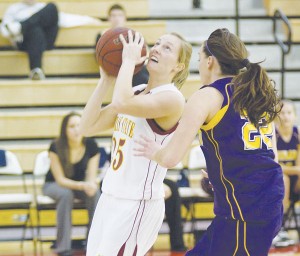 Competitive Spirit: Sophomore Ashley Huntey demonstrates that her skills extend beyond her 229 kills and 365 digs attained this season in volleyball and onto the basketball court, helping the Bulldogs toward their 75-57 win over Ashland on Friday. Photo Courtesy of Ed Hyde, FSU Photographic Services