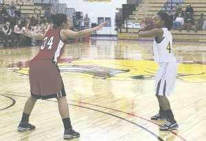 Making a Pass: Junior Tiara Adams (#44) gears up for a pass in the recent game against Lewis. Throughout the game, Adams scored 13 points and had three steals and 3 assists. The Bulldogs walked away with a 74-66 victory. Photo By: Kristyn Sonnenberg | Photo Editor