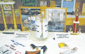 Rube Goldberg: Pictured here are trophies earned by the Ferris State Rube Goldberg team in 2007 along with a photo of the team that will now be heading to Japan to take part in a game show. Photo By: Kristyn Sonnenberg | Photo Editor