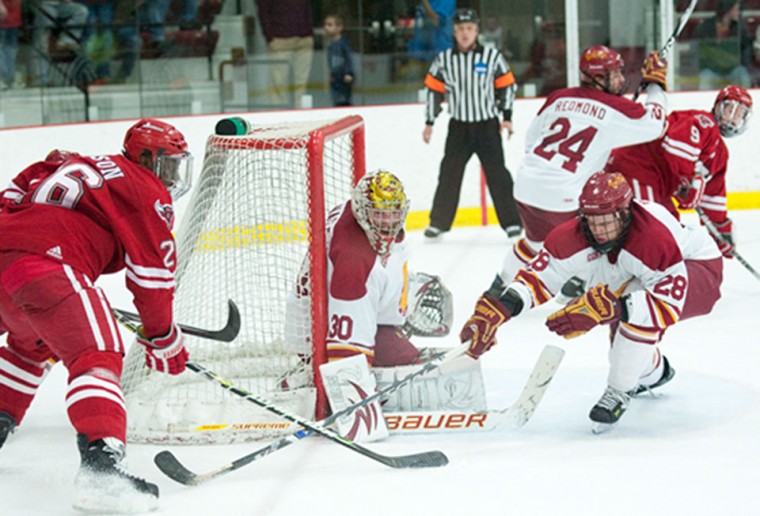 Shut Down: Goalie Pat Nagle and left wing Kyle Bonis stopped a Nebraska-Omaha forward from scoring in last Friday’s home game. The bulldogs later went on to defeat Nebraska-Omaha 3-1. Photo courtesy of Ed Hyde | Ferris State Athletics