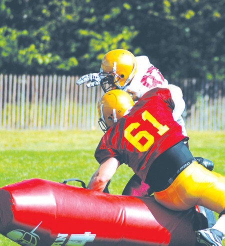 Striving to Improve: Ferris football players begin to practice for the 2010-2011 season, where they hope to improve on last season’s record of 1-10. There are high hopes for the Bulldogs with a new offensive strategy and many returning players. Photo By: Kendall Baumann | Production Assistant