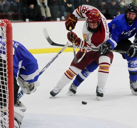 Swept Series: Mike Embach maneuvers past an Alabame-Huntsville defender. The Bulldogs swept the series against the Chargers, bringing the 2010-11 record to 16-12-4. Photo By: Brock Copus | Photographer