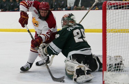 Defeating the Spartans: Kyle Bonis attempts to knock a puck into the net against the Spartan’s goalie. The Bulldogs defeated MSU 2-1 on Jan. 27, bringing the 2010-11 record to 12-12-4 overall. Photo By: Brock Copus | Photographer