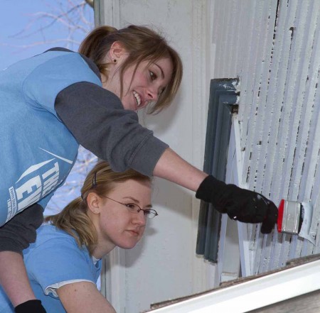 Sprucing Up: Jenna Day and Megan Willenstein, left to right, help give a house a new coat of paint during the BIG Event on April 9. Photo By: Brock Copus | Photographer Sprucing Up: Jenna Day and Megan Willenstein, left to right, help give a house a new coat of paint during the BIG Event on April 9. Photo By: Brock Copus | Photographer
