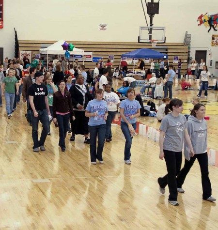 Showing They Care: Students walk during the Relay for Life on April 1. The walk gave college students a chance to be a part of an event to raise awareness.  Photo By: Brock Copus | Photographer