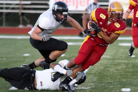Battling Ohio: William Fraizer, senior wide receiver, battles through Ohio Dominican defensemen during the game on Sept.17. The Bulldogs defeated the visiting Panthers 35-13 to improve to 2-1 overall for the 2011 season.Photo By: Brock Copus | Multimedia Editor