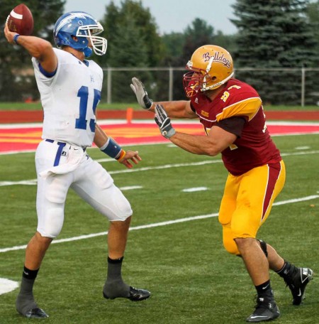 Tied Season: Muneer Bawayeh, FSU senior defensive lineman, charges the Hillsdale quarterback in the Bulldogs 20-17 win Sept. 2. FSU lost to SVSU Sept. 10 dropping the Bulldogs to 1-1 overall for the 2011 season.  Photo By: Brock Copus | Multimedia Editor