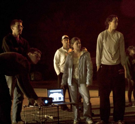 Aligning Projections: Design professor William Culpepper helps senior design students Keith Kuchek, Ben Bialek, Samantha Martin and Anne Sutton line up their projector at 720 N State Street. Photo By: Kate Dupon | Photo Editor