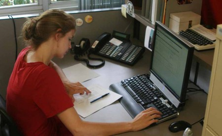 Changes, Changes: Ferris student Courtney Matuszak works at the Office of Housing which recently moved locations to the Helen Ferris lobby. The Telecommunication Services will now be located in the old housing office in the Rankin Center. Photo By: Kate Dupon | Photo Editor