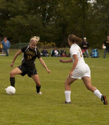 Manuevering Tech: Kasey Ruimveld, senior defender, manuevers past a Michigan Tech opponent during the Sept. 17 game. Photo By: Kate Dupon | Photo Editor Manuevering Tech: Kasey Ruimveld, senior defender, manuevers past a Michigan Tech opponent during the Sept. 17 game. Photo By: Kate Dupon | Photo Editor