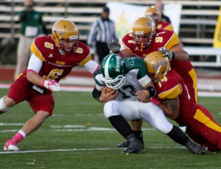 Tackling Erie: Junior linebacker Mike Elias, freshman defensive tackle Jeffrey Dean and junior defensive end Jordan Morgan (from left to right) stop a Lake Erie player. The Bulldogs lost to Findlay 43-35 on Oct. 8 bringing the 2011 record to 4-2 overall. Photo By: Brock Copus | Multimedia Editor
