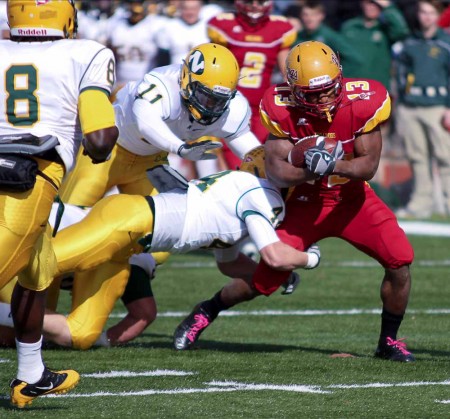 Defeating the Wildcats: FSU junior running back Dwayne Williams battles past Northern defensemen. The Bulldogs win against Northern brings the 2011 record to 5-2. Photo By: Brock Copus | Multimedia Editor