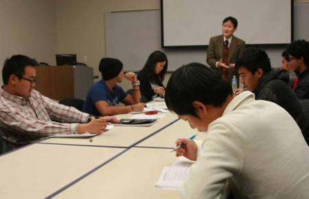 International Students: Professor Dan Goldner teaches an Intermediate English class with international students Peng Yang, Ammar AlHakami, Ayaka Nose, Mohsen Alnajrani, Ahmad Alghamdi, Hoa Doa and Minwoo Kim, left to right. Photo By: Kate Dupon | Photo Editor