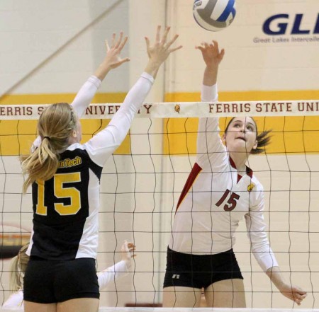 Photo Ratem:  Freshman middle hitter Courtney Rehm goes up for an attack against a Michigan Tech player for a win. Photo By: Brock Copus | Multimedia Editor  