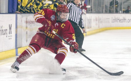 Bonis Bonus: Bulldog senior left wing Kyle Bonis controls the puck as he stops within Michigan’s zone. The Bulldogs dropped Friday’s game against Michigan 4-1, while Saturday ended with a 1-1 tie at the end of overtime. Photo By: Brock Copus | Multimedia Editor