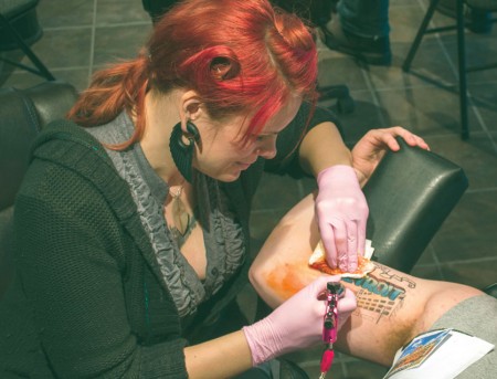 INK’d: Sonya Grenell, Ferris State alumna and tattoo artist, works on a piece at her downtown tattoo studio Lighttouch Tattoo. Photo By: Eric Trandel | Photographer