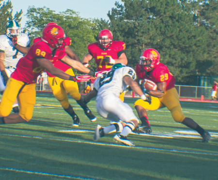 Running back Korey Ringer (28) pushes through Lake Erie’s defense during Ferris’ first home game. This past weekend, the Bulldogs went up against Ashland, winning 34-7. Their next game is Sept. 28 at Walsh. Torch File Photo 