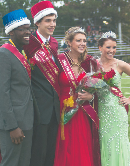 Kevin Bunce and Katie Rachon (center) were crowned 2013 FSU Homecoming King and Queen during Saturday’s football game by last yea’s royalty, Byron Williams and Avery Larson. Bunce is a senior in ornamental horticulture and business administration. Rachon is a senior in pre-optometry. Photo By: Tori Thomas | Photographer 