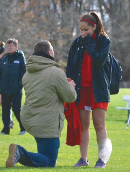 Former Bulldog Skyler Stoker proposes to senior defender Audra Merino after the senior day soccer game. Stoker and Merino both plan to finish school before having the wedding. Courtesy Photo Provided by: Audra Merino
