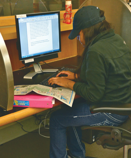 Social work major Michele Loney works on her homework and receives tutoring as part of OMSS and the Ferris Honors program’s extended tutoring hours. The extended tutoring is from 5 to 10 p.m. in FLITE 159 and will run until Nov. 30.  Photo By: Olivia Odette | Photographer