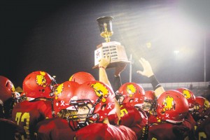 The Ferris State football team lifts the Anchor-Bone trophy following the 2013 installment of the Grand Valley State game. 2013 was Ferris State’s second consecutive victory, giving Ferris a shot to win their third straight against GVSU.