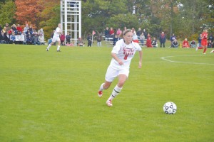 The Bulldogs own junior mid fielder, Stephanie Garland, advances the ball against Saginaw valley State during the 2013 season.