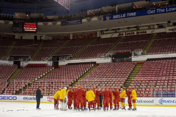 Ferris huddles around head coach Bob Daniels at practice on Sunday, December 28.