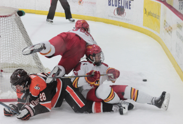 Kenny Babinski and Jared VanWormer land in a heap.