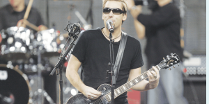 Nickleback, lead man, Chad Kroeger performs during a football game at Ford Field in Detroit.