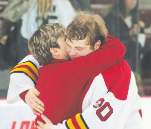 Senior goal tender, CJ Motte, embraces his mother into a hug on senior night.