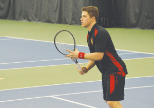 Laurent Galarneau prepares for a serve in a recent tennis match.