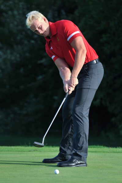 Senior Zak Kiefer lines up his shot during the 2014-15 season.
