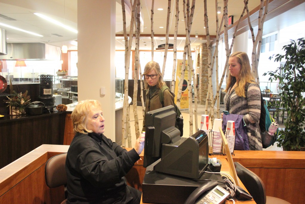Mary Cook swipes in students at the Quad Cafe, where more and more students are deciding to dine between classes