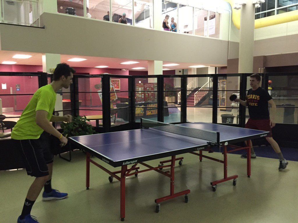 Ferris pre-optometry junior Ryan Chrencik (left) faces off against energy systems engineering student Xavier Locke (right) at a table tennis match in the University Recreation Center.