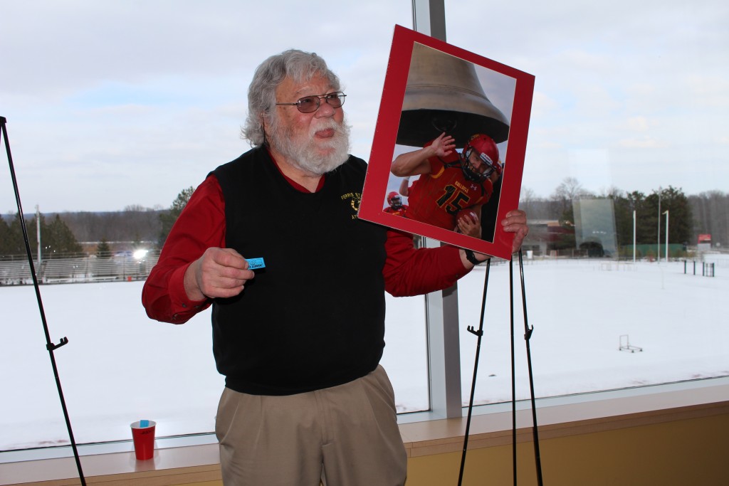 Bruce Dilg, who played a key roll in the creation of the Festival of Arts nine years ago, drew tickets for the raffle of various sports-related artwork and Bulldog memoribillia including the signed print of Jason Vander Laan featured above.