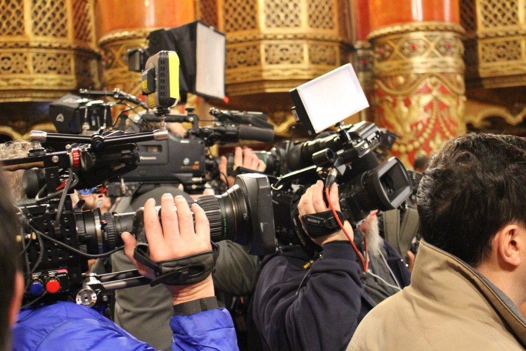 A flock of media staff from outlets including Fox News, CNN and MSNBC clamor for the attention of candidates in the spin room after the debate.