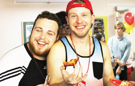 Ferris human resource management senior Esad Miftari (left) and architecture and sustainability senior Corey Nichols (right) took part in the food and activities offered at Birkam Health Center’s 2016 open house.