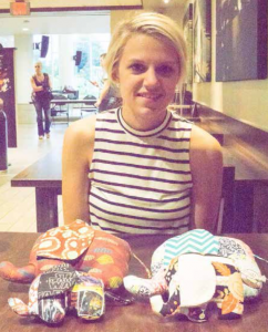 Ashley Modrzynski displays custom stuffed elephants that she crafts and donates to local  hospitals. 