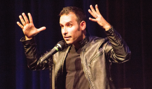 Daniel Martin performs in Williams Auditorium to an energetic audience as he responds sarcastically and makes jokes about the recent clown sightings around Big Rapids, Reed City and the United States.