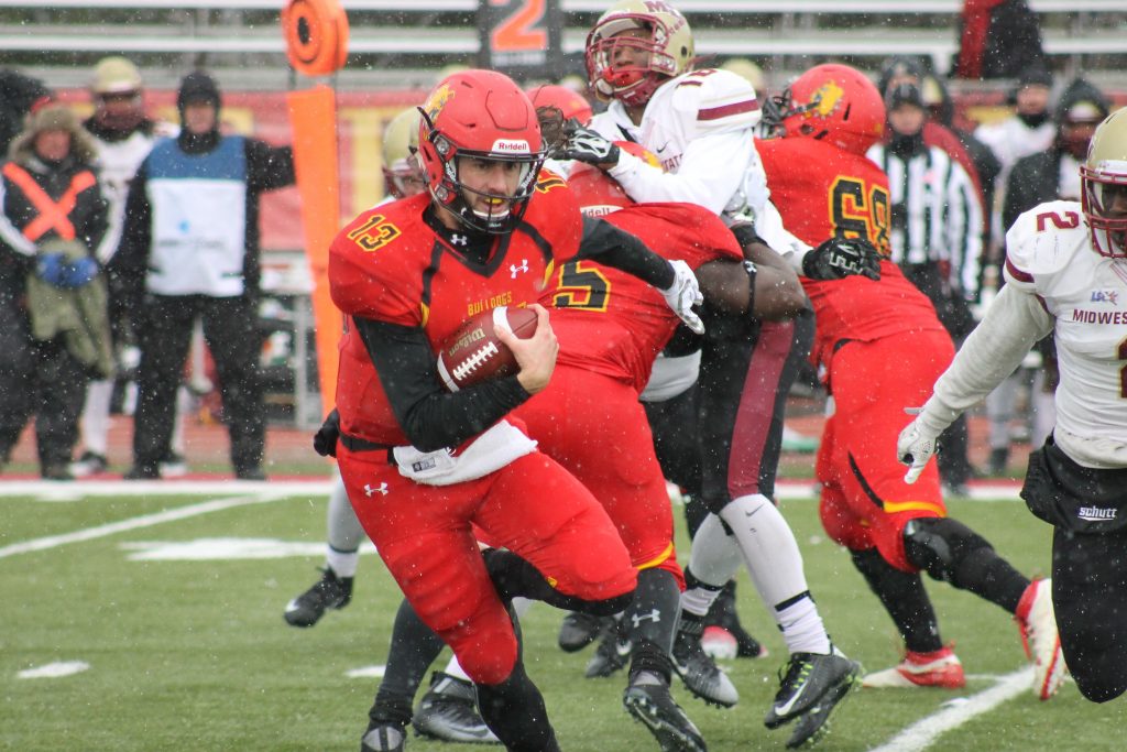 After starting quarterback Reggie Bell went down with an injury early in the first half, senior quarterback Trevor Bermingham took over and led the Dawgs to a 65-34 victory