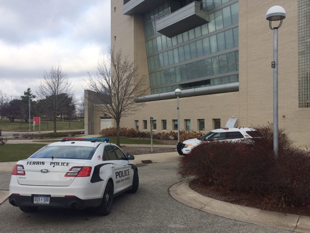 Two police cars were parked in front of FLITE during the evacuation.