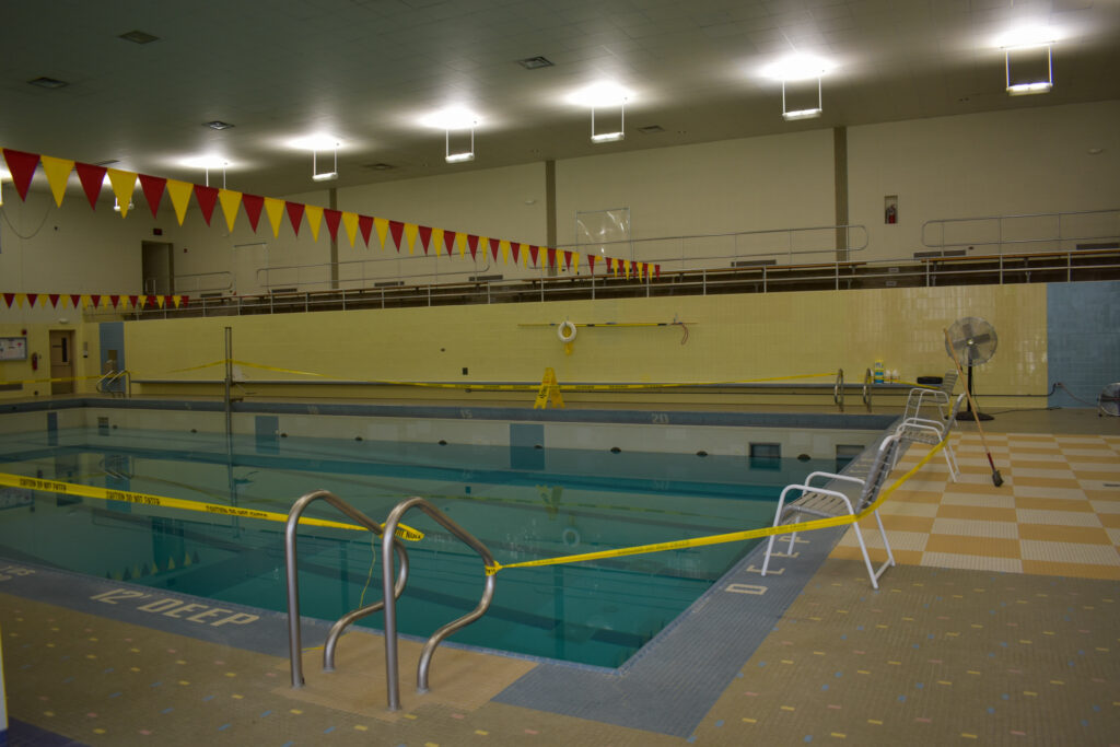 The rec. center pool is cordoned off with caution tape 
